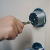 key-in-hand-unlocking-door_925x